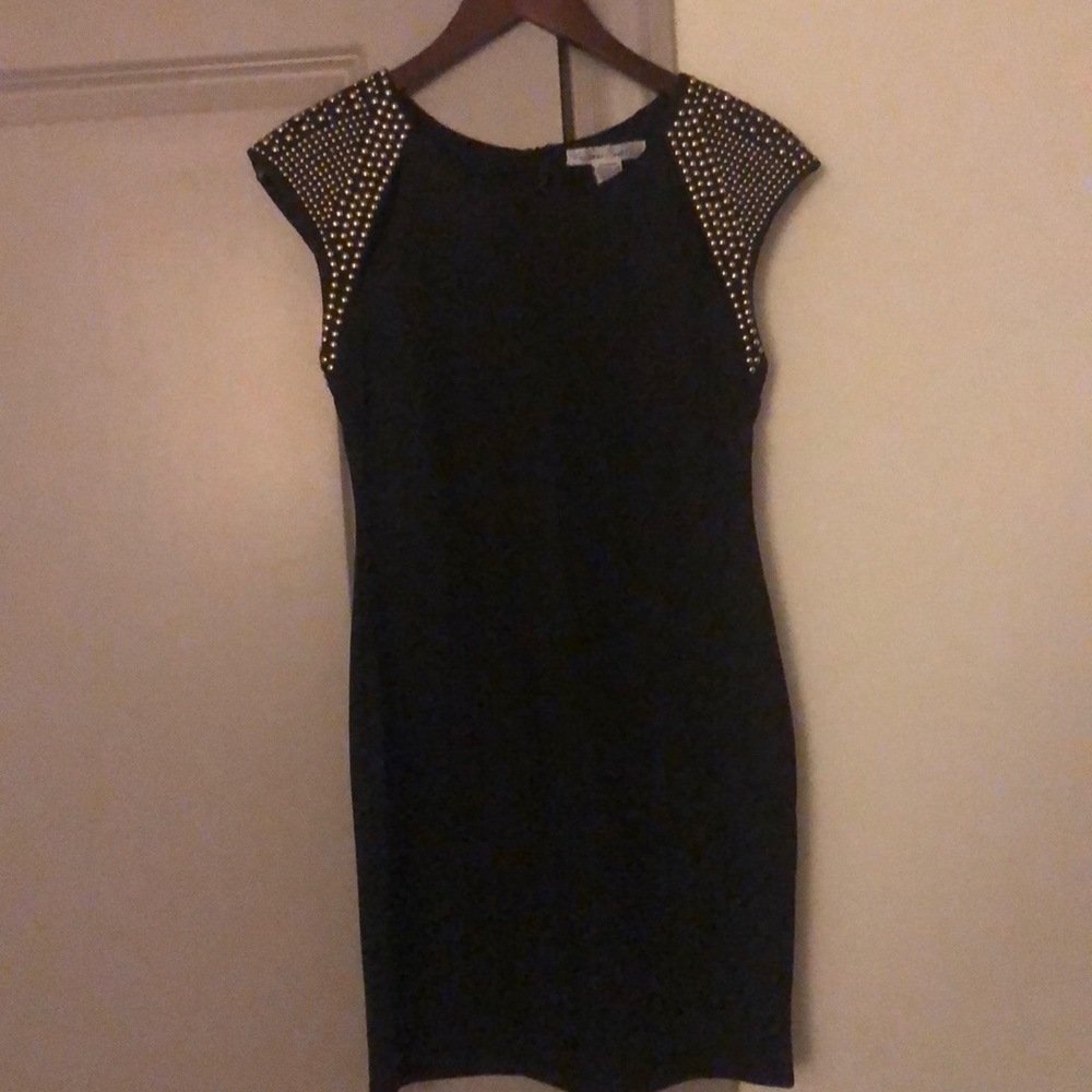 Black dress with gold studs on shoulder